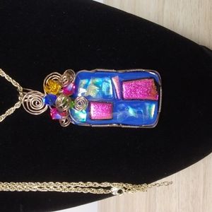 Beautiful artistic pendant on long silvertone chain pink and blue